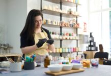 Get Started Selling Your Nerdy Crafts on Etsy A woman working on her handmade, colorful sculpted candles that she'll put on her nerdy Etsy store.