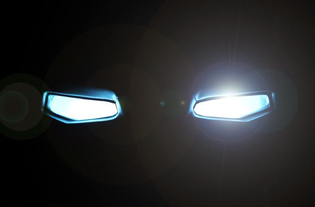 steeda-409750-glowing-eyes-background-Image1 A black background features two rectangular-shaped eyes glowing with a bright white light and a slight glare.