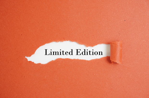 How Rarity Is Measured in the Collectibles World A rough, reddish-orange construction paper surface with a strip peeled away to reveal the words "Limited Edition" beneath.