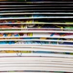 What Makes a Comic Feel Premium in Print? A close-up of a comic book with pages mid-flip, revealing brief glimpses of the colorful interior artwork.