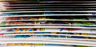 What Makes a Comic Feel Premium in Print? A close-up of a comic book with pages mid-flip, revealing brief glimpses of the colorful interior artwork.